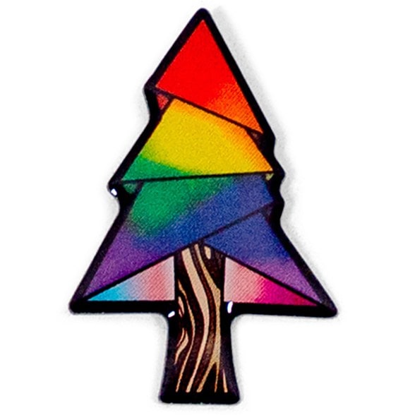 Close-up view of the Outdoor Allyship Lapel Pin against a rustic background