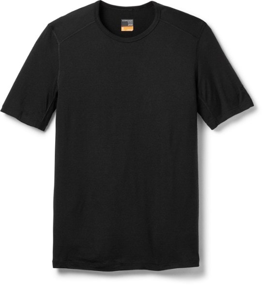 Men's merino wool thermal top displayed in a scenic outdoor setting, showcasing its breathable fabric and comfort.