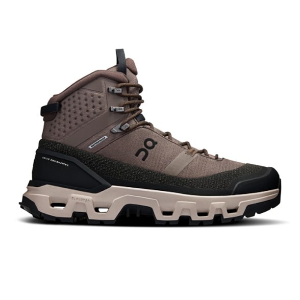 Side view of Cloudrock Trek Pro Waterproof Hiking Boots for Men on rocky terrain.