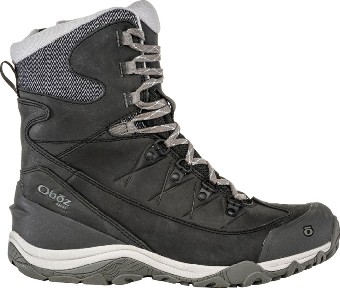 Side view of Ousel Mid Women's Insulated Waterproof Hiking Boots on snowy trail.