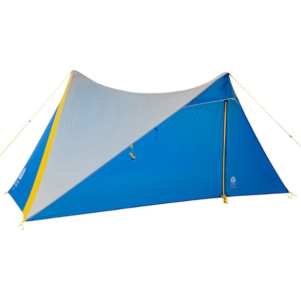 Sierra Designs Ultralight 2-Person Tarp Shelter setup in a forest clearing.