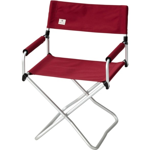 Close-up side view of the camping chair showing padded armrests and sturdy canvas seat.