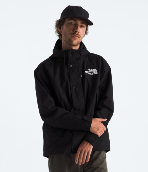 North Face Reign On Men's Waterproof Jacket on a hiking trail, showcasing its durability and waterproof features.