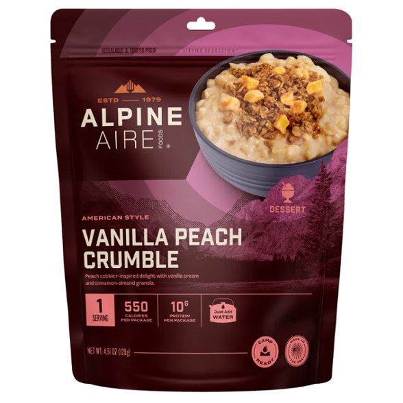 AlpineAire Vanilla Peach Crumble served in a bowl outdoors, showcasing its rich texture and color.