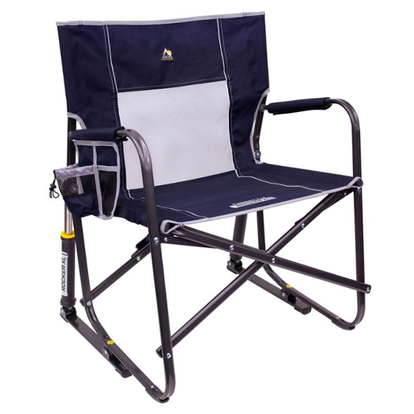 GCI Outdoor Freestyle XL Rocking Chair with a scenic background, showcasing its wide seat and armrests.