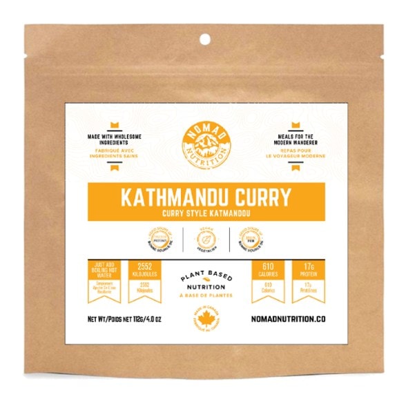 Close-up of Kathmandu Spice Fusion Curry in a hiking setting, showcasing its rich colors and ingredients.
