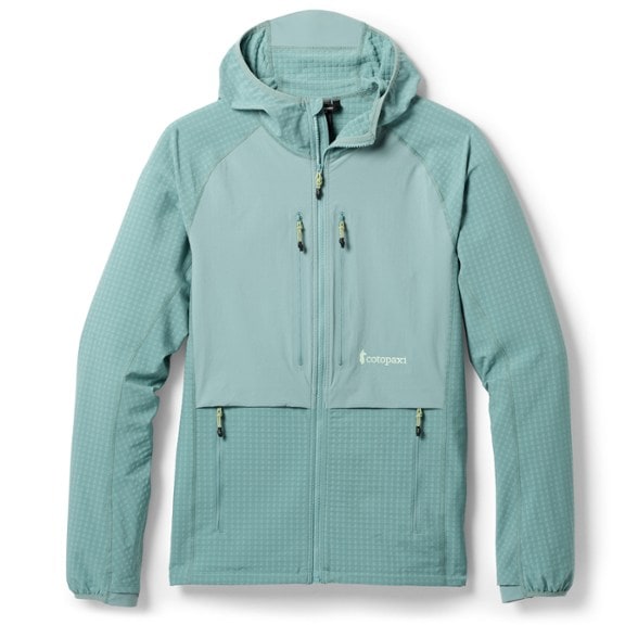 Yermo hooded jacket shown in a hiking environment, featuring zipped pockets and adjustable hem.
