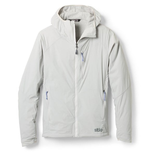 Front view of the Dawner Active insulated jacket for women in a vibrant outdoor setting, showcasing its sleek design and packable features
