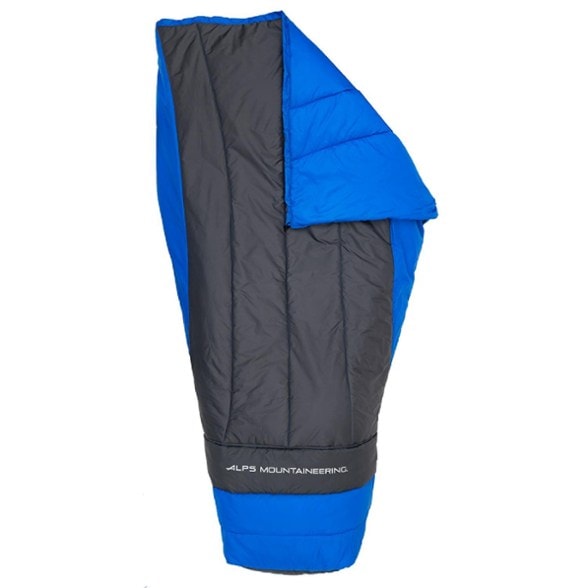 Radiance 35 camping quilt displayed in a tent with a sleeping pad underneath, showcasing its oversized footbox.