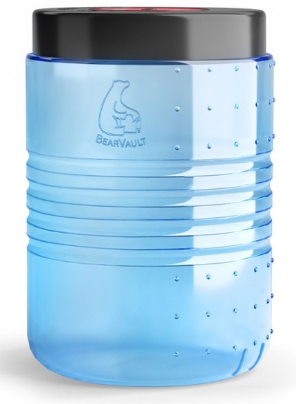 AdventureGuard Bear Canister in a forest setting, showcasing its lightweight design and wide opening.