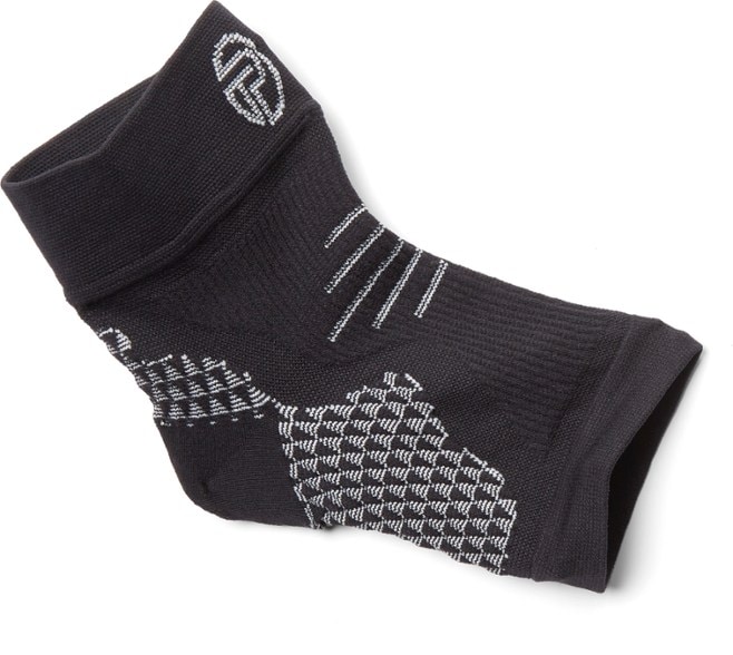 Pro-Tec Plantar Fasciitis Compression Sleeve worn during a run, showcasing its open-toe design.