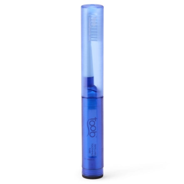 Aurelle TravelBrush Pro shown in a camping setting with the refillable toothpaste tube.
