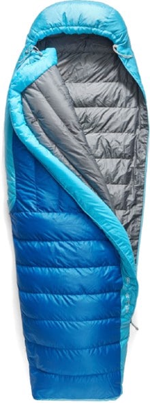 TrekZero 0F down sleeping bag fully zipped with water resistant shell in snowy forest setting