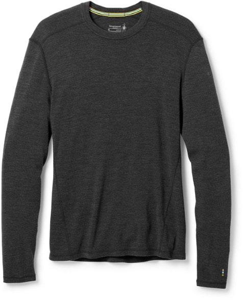 Men's long sleeve thermal top worn during a winter hike, showcasing breathability and comfort.