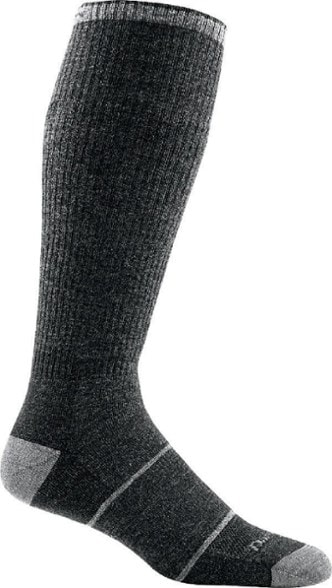 Darn Tough knee-high merino wool work socks in a cozy workspace setting.