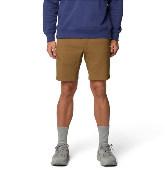 Men's trail shorts in action during a summer hike, showcasing flexibility.