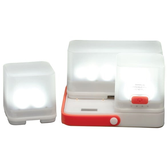 LuminAID Trio Solar Lantern in a campsite setting, showcasing its modular LED units.