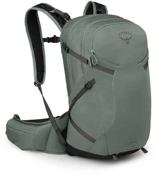 Osprey Sportlite 25 Daypack with trekking poles attached, perfect for day hikes.