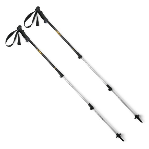 Leki Journey Lite trekking poles in action on a mountain trail, showcasing adjustable length and ergonomic grips.