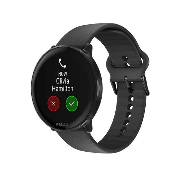 Polar Ignite 3 fitness watch with AMOLED display on a running track, demonstrating its lightweight design.
