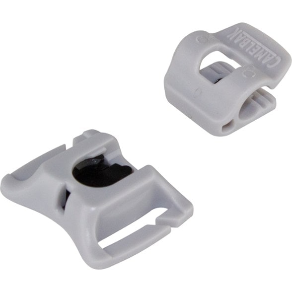 Close-up of the magnetic tube clip mounted on a hiking backpack strap