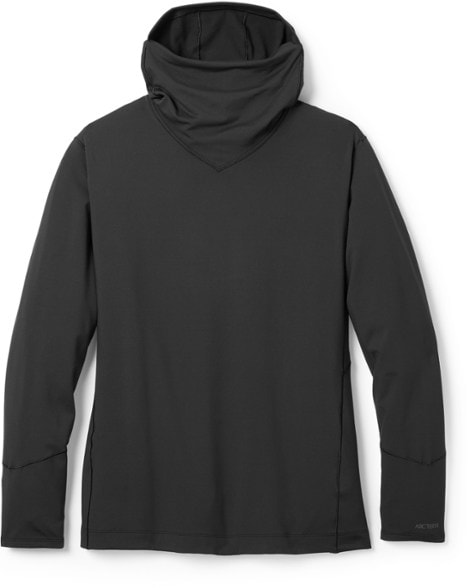 Arc'teryx women's lightweight fleece hoodie in action during a hike, showcasing the balaclava-style hood.