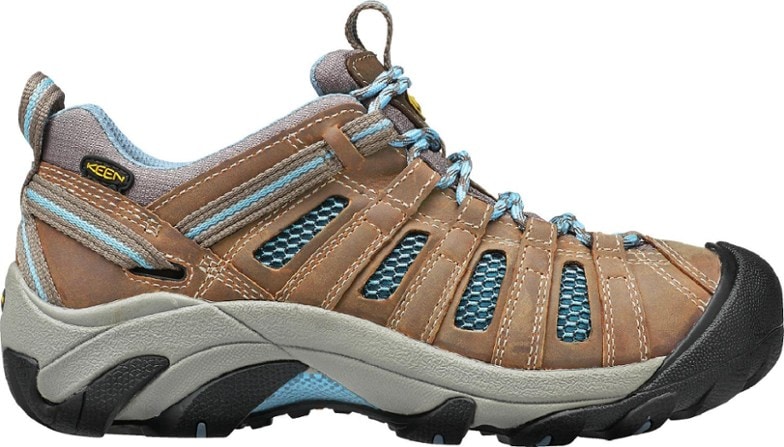 KEEN women's Voyageur hiking shoes in action on rocky trails.
