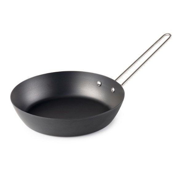 Angle view of the durable carbon steel frypan, showcasing its robust build.