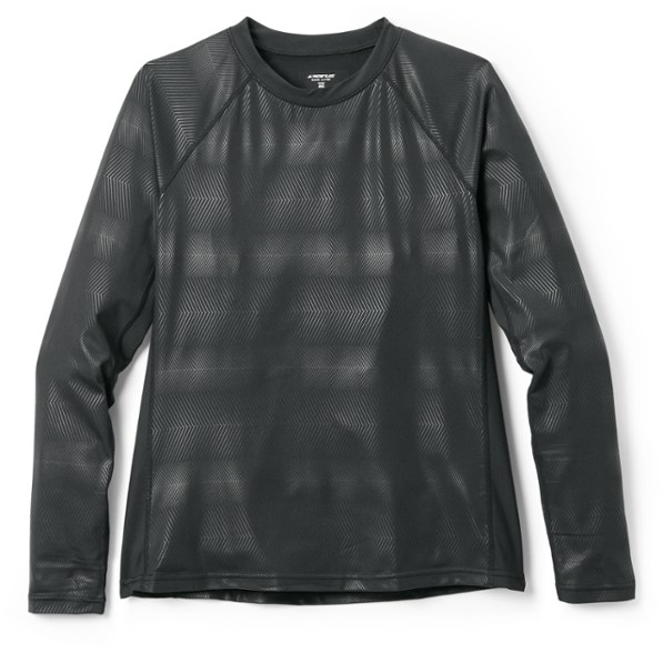 Front view of women's thermal base layer top in action during winter sports.