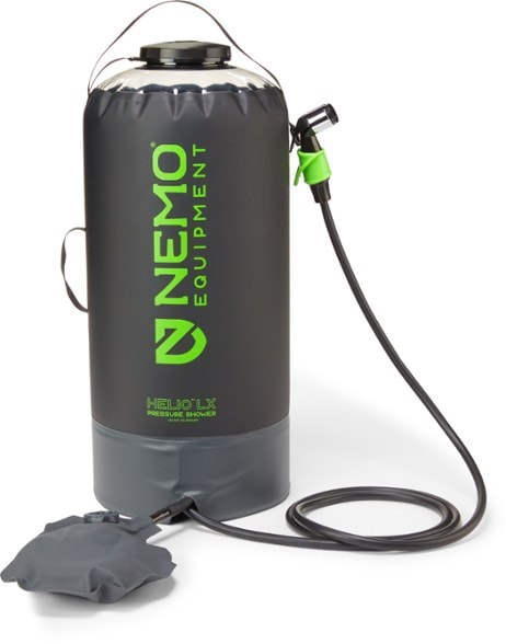 NEMO Helio LX portable pressure shower in outdoor setting with hose extended