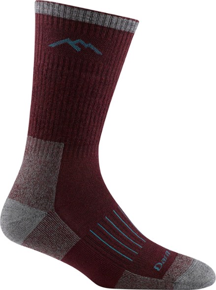 Darn Tough Women's Midweight Hunting Socks displayed on a rustic wooden surface, showcasing their texture and design.