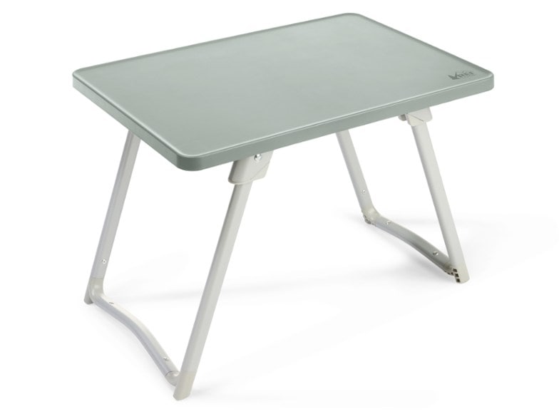 Portable side table for campfire setup with drinks and snacks.