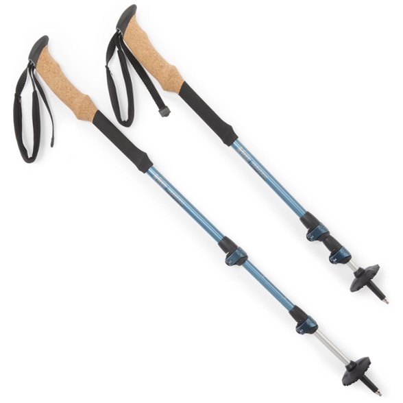 Close-up of REI Co-op Traverse trekking poles showing ergonomic cork grips.