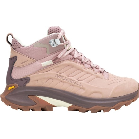 Side view of the Merrell hiking boots on a rocky trail showing waterproof design.