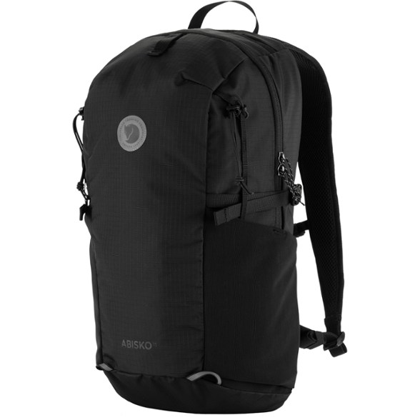 Eco-Friendly Softpack 16 backpack in use during a mountain hike, showcasing its water-resistant features.