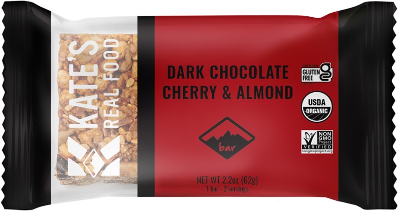 Close-up of the cherry almond bar sliced to show dark chocolate and nut texture