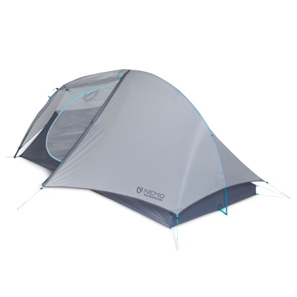 Side view of the ultralight 2-person tent pitched in a forest, showing dual vestibules and compact footprint