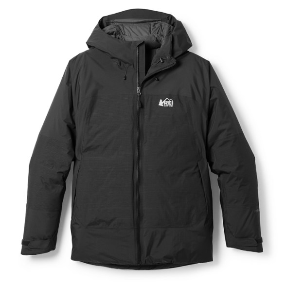 Front view of men's waterproof winter jacket Stormhenge 850 with hood up in snowy outdoor setting