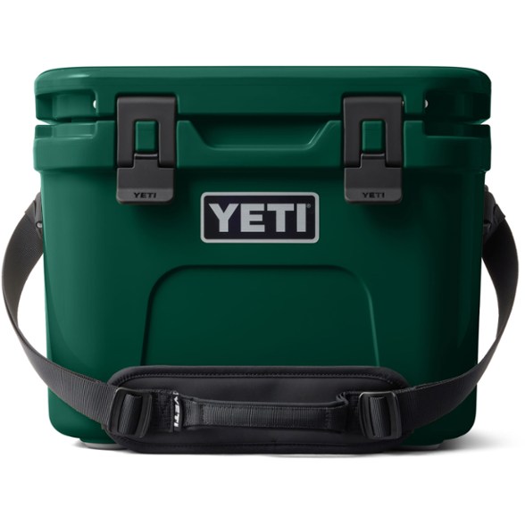 YETI Roadie 15 cooler in action on a beach, showcasing its portability.