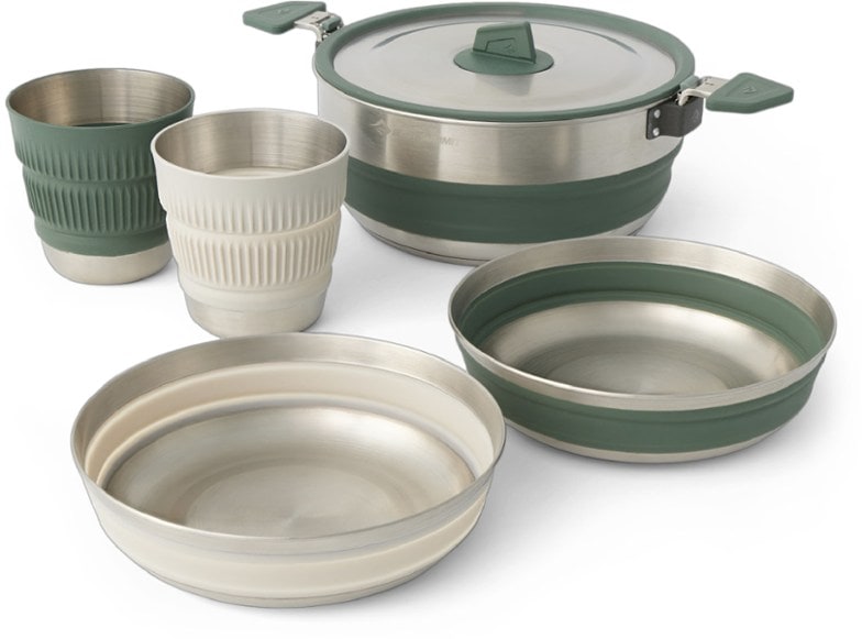 Overhead view of the collapsible pot, bowls, and mugs nested together inside the stainless steel cookset