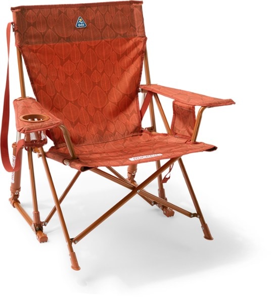 Comfort Plus Portable Rocking Chair with cup holder in a campsite setting.