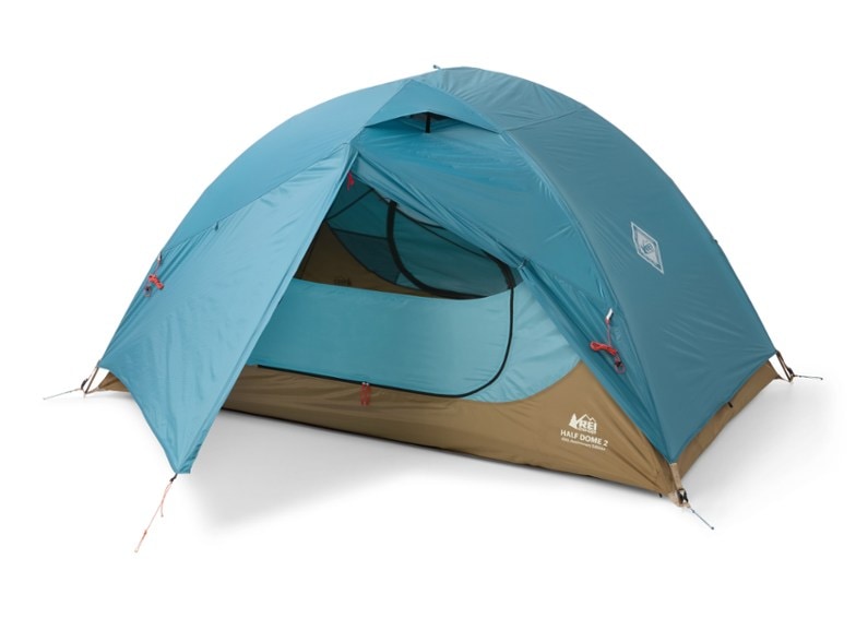 Half Dome 2 Tent setup in a scenic forest setting, showcasing its spacious interior.