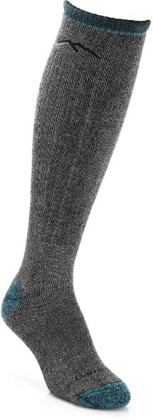 Women's thermal mountaineering socks displayed on a snowy trail, showcasing knee-high design.