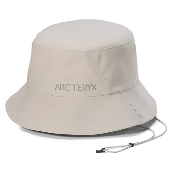 Front view of the ArcTrail bucket hat showing its full brim and chin strap for windy hikes.
