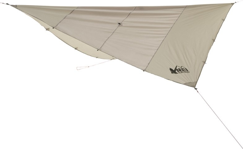 Half Dome tarp pitched over campsite providing rain shelter in forest setting