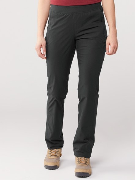 KÜHL Freeflex Women's Adventure Pants showcased on a hiking trail, emphasizing quick-dry fabric.