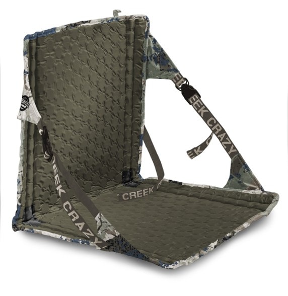 UltraLite Trail Chair set up on a hiking trail, showcasing its compact design.