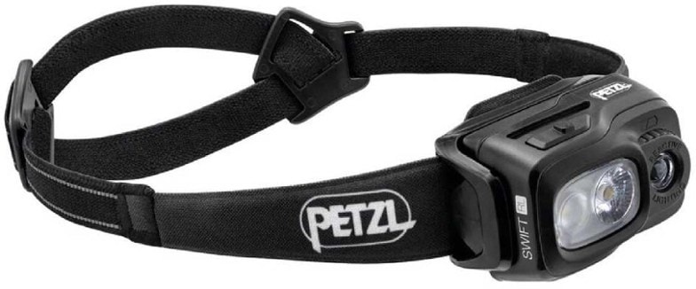 Petzl Swift RL headlamp showcasing its adjustable beam during a night hike.
