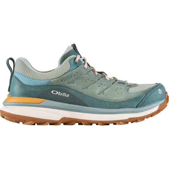 Hyalite Low-Cut Hiking Shoes for Women in action on a rocky trail, showcasing their waterproof design.