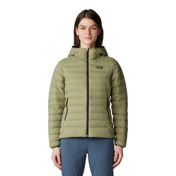 Alpine Adventure Women's Down Hoodie in a mountain setting, highlighting its lightweight design.